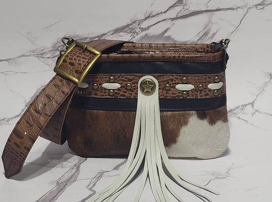 Western Belle in leather and brown/white cowhide.