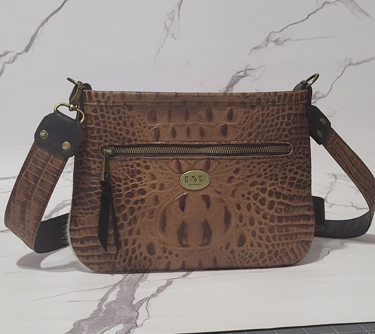Western Belle in leather and brown/white cowhide.