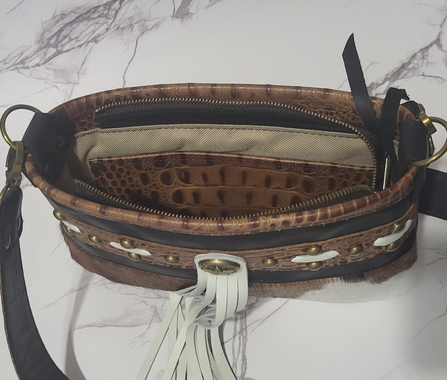 Western Belle in leather and brown/white cowhide.