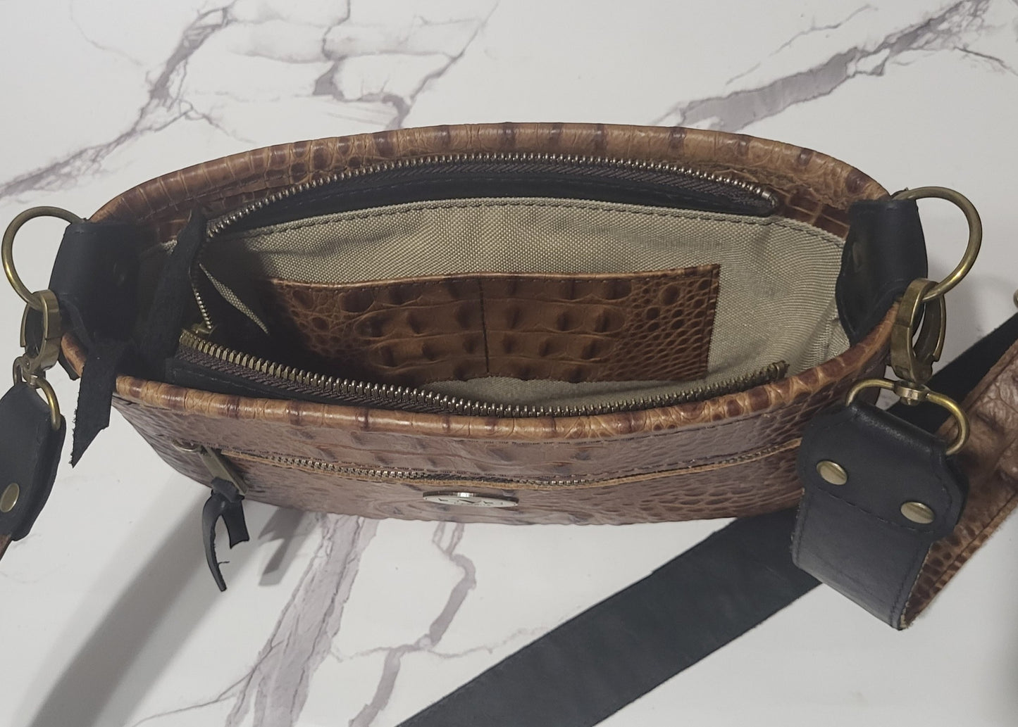 Western Belle in leather and brown/white cowhide.