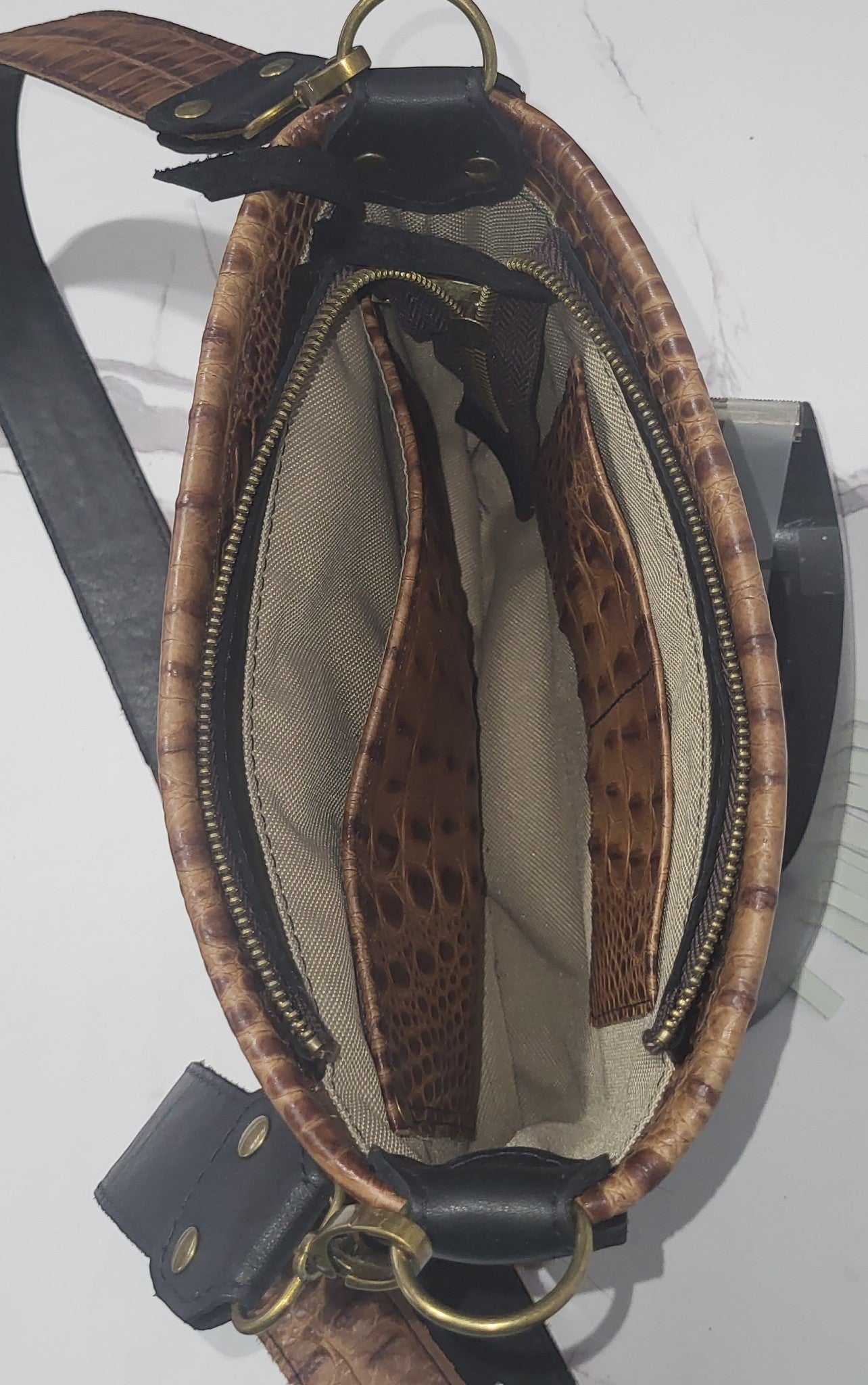 Western Belle in leather and brown/white cowhide.